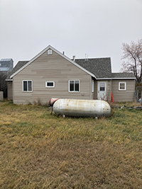 a house with trees in the background